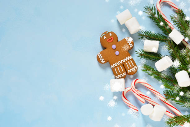 istock New Year's blue background with ginger biscuits, sweets and caramel. Happy New Year and Merry Christmas. 891224480