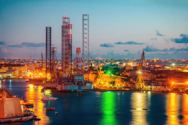 istock panoramic aerial skyline view to Grand Harbor in night, Valletta, Malta 891235768