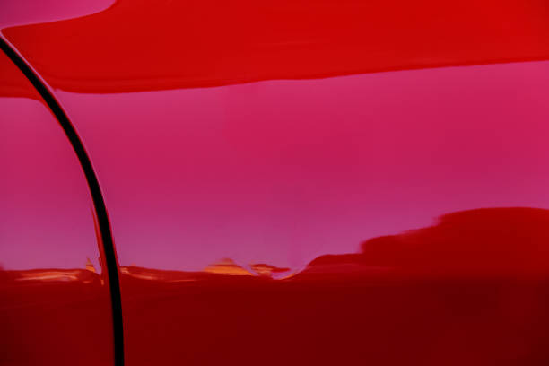 istock Reflections in side wing of red sport car 891242644