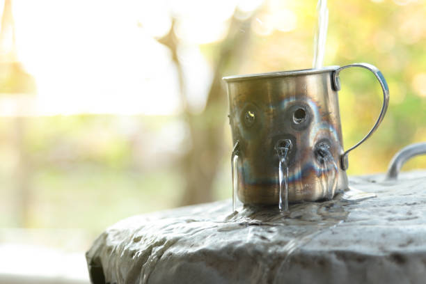 Metal cups against nature background