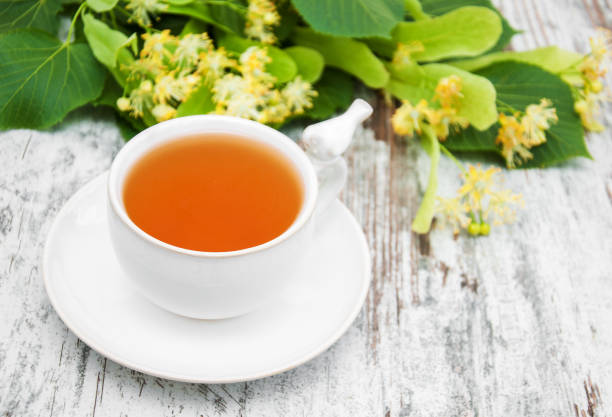 istock cup of herbal tea with linden flowers 891251064