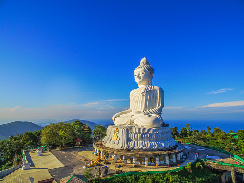 scenery blue sky and blue ocean are on the back of Phuket Big Buddha statue on the top of mountain.