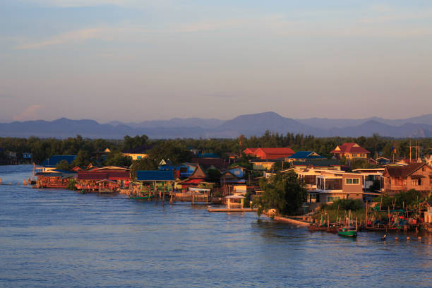 the landscape of fishing village with the mountain background in Thailand