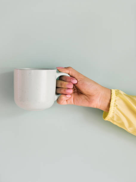 istock Closeup of hand holding coffee cup 891280992