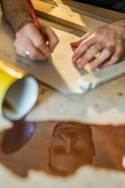 istock Reflection in coffee spilling of a male architect. 891281334