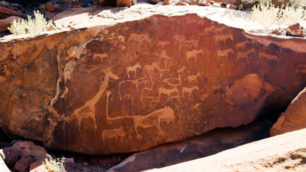 Prehistoric petroglyphs at Twyfelfontein archaeological site, Namibia Prehistoric petroglyphs at Twyfelfontein archaeological site in Namibia kudu stock pictures, royalty-free photos & images