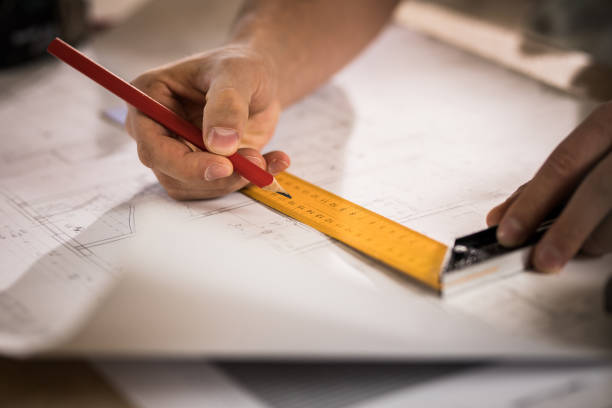 istock Close up of unrecognizable architect improving housing project. 891281570