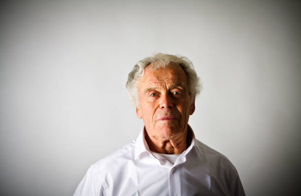 istock Old man in white. Portrait of Old Man 891284062
