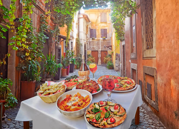 Pasta , pizza  and homemade food arrangement  in a restaurant  Rome A summer  dinner .Pasta , pizza  and homemade food arrangement  in a restaurant  Rome   .Tasty and authentic Italian food. spaghetti photos stock pictures, royalty-free photos & images