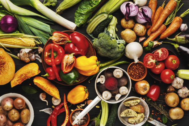 istock Heap of fresh vegetables on wooden background with copy space 891294280