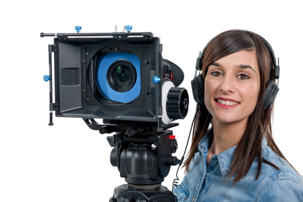 istock beautiful young woman with professional DSLR video camera, on white 891294384