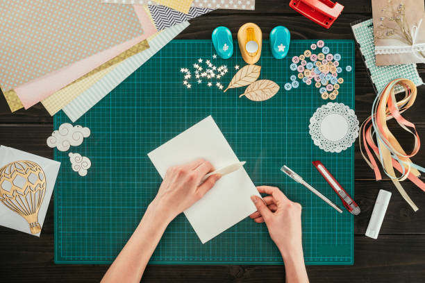 istock cropped image of artist making greeting scrapbooking postcard 891296782