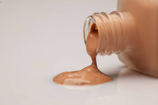 istock a glass bottle and a liquid base that is drawn from it 891297104