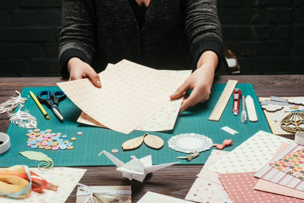 istock cropped image of designer choosing paper for scrapbooking postcard 891297588