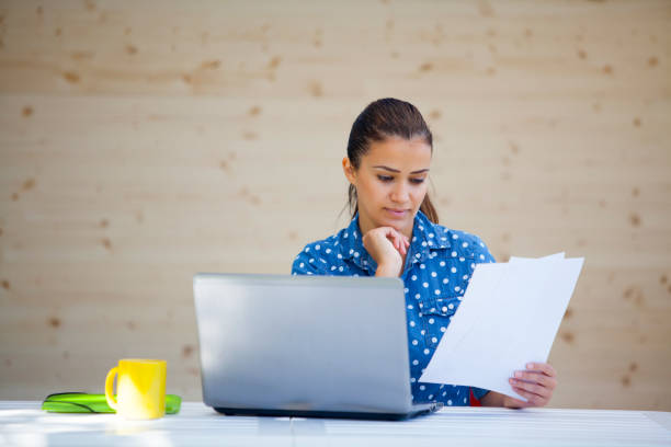 istock young woman working in office 891298028