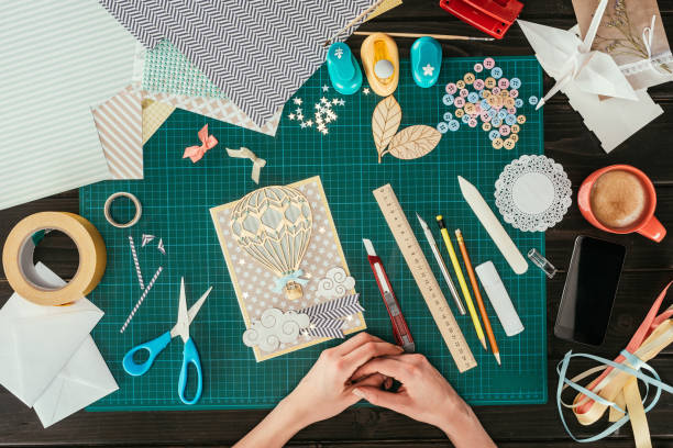 istock cropped image of designer sitting with scrapbooking handmade postcard at working table 891300426