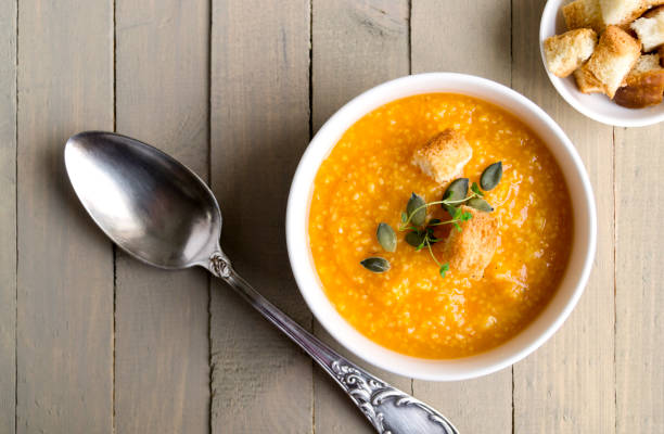 istock Vegetarian pumpkin soup on a wooden table. 891300598