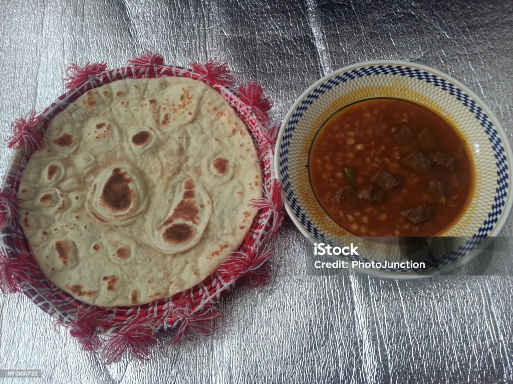 Pakistani cuisine: Daal gosht (Beef) curry Pakistani cuisine: Daal Gosht (Beef) curry with roti (bread) Beef Stock Photo