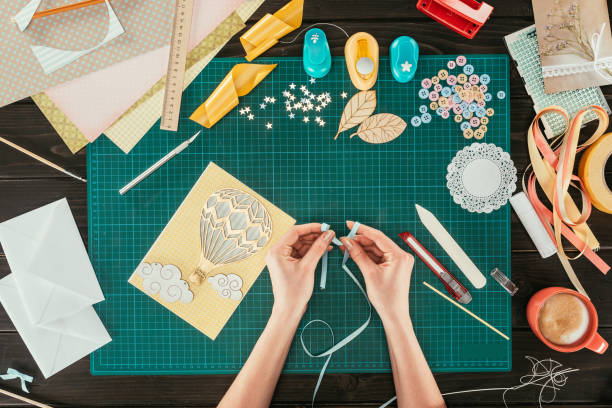 istock cropped image of designer making bow with ribbon 891300928