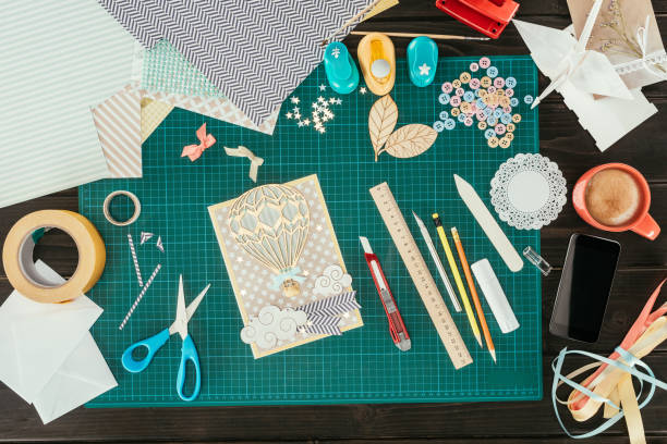 istock Top view of designer working place with scrapbooking postcard template 891303196