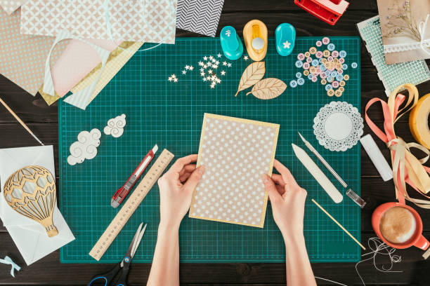 istock cropped image of designer holding template for scrapbooking postcard 891303898