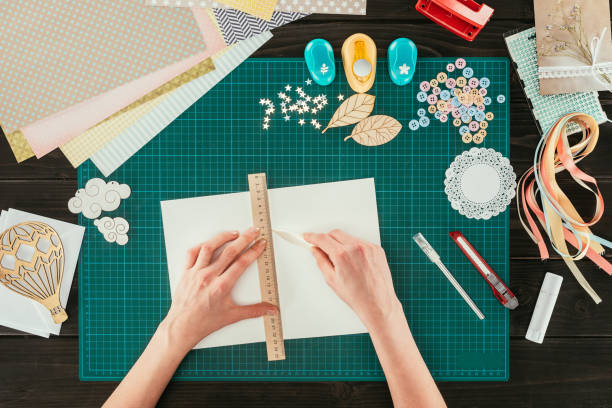 istock cropped image of woman measuring space for postcard with ruler 891304224