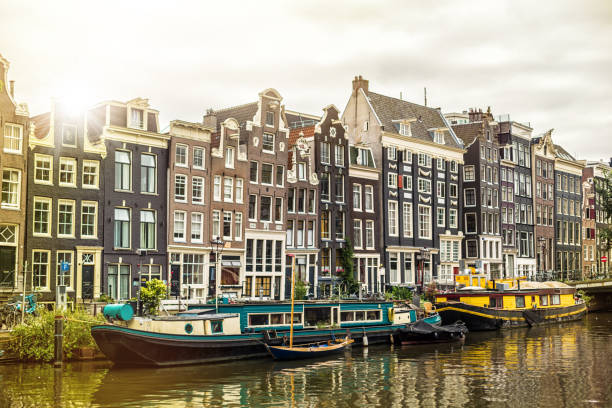 istock Amsterdam Canal with houseboats 891306478