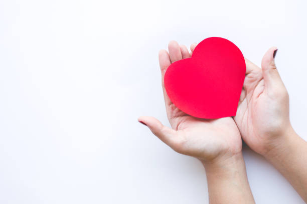istock Female with red paper heart shape on white background. 891310296