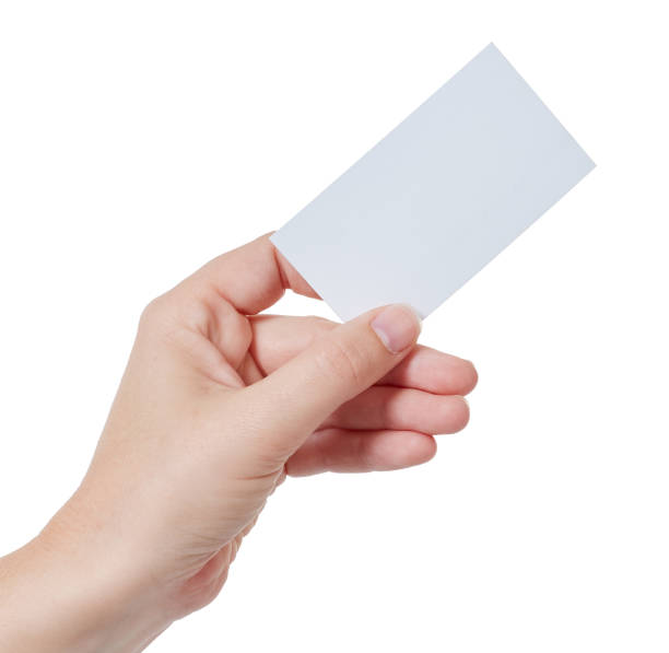 istock Left hand holds aloft a blank white business or name card 891310344