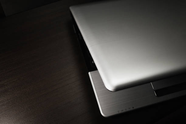 istock laptop on dark wooden background 891310534