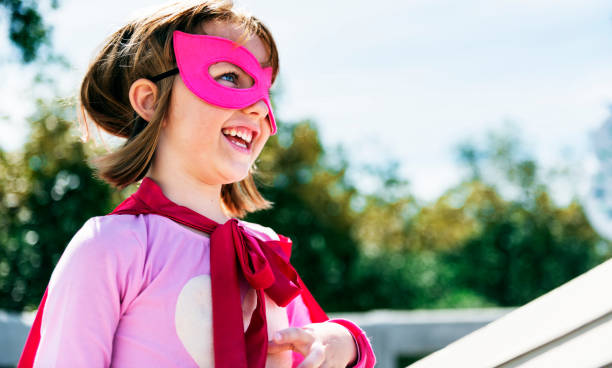 istock Little cute girl playing superhero 891316040