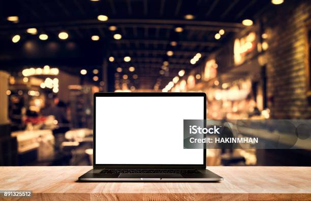 Modern Computerlaptop With Blank Screen On Table Cafe Shop Stock Photo - Download Image Now