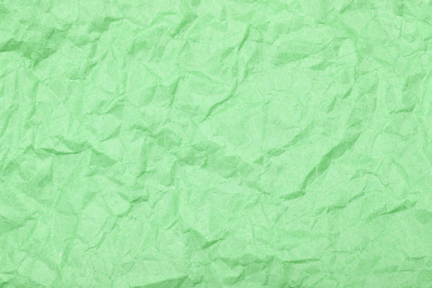 istock Crumpled sheet of paper. Texture closeup. 891325996
