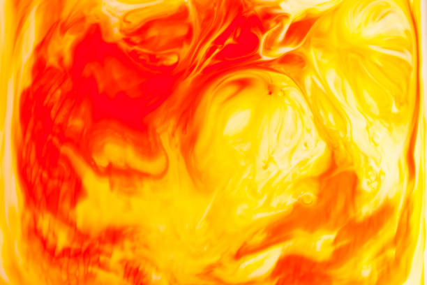 istock Orange oil paint on water abstract background. 891326688