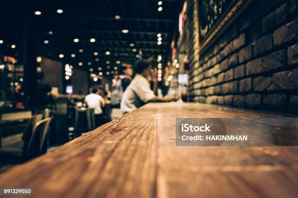 Blur Of Wood Bar Table In Night Cafe Selective Focus Stock Photo - Download Image Now