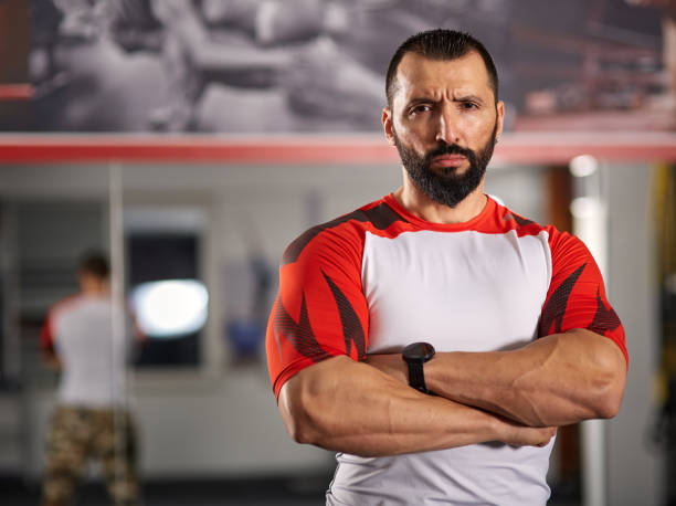 istock Fitness coach posing in the gym 891329524