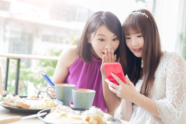istock woman friends in restaurant 891332888