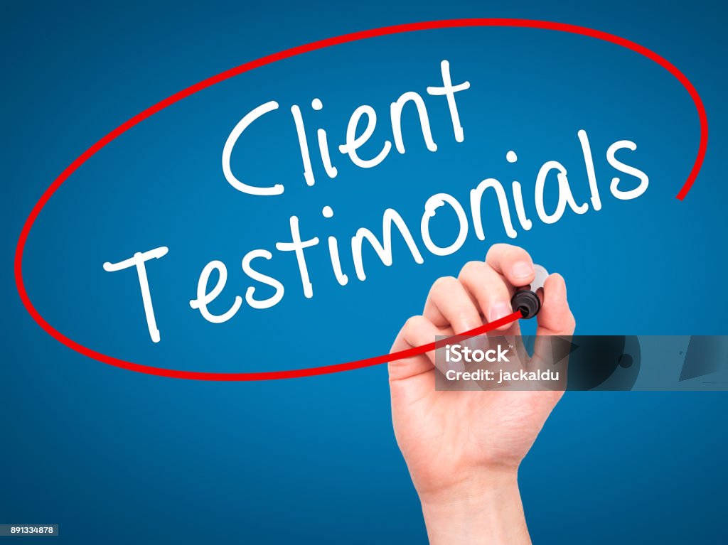Man Hand writing Client Testimonials with black marker on visual screen Man Hand writing Client Testimonials with black marker on visual screen. Isolated on blue. Business, technology, internet concept. Stock Photo Testimonial Stock Photo