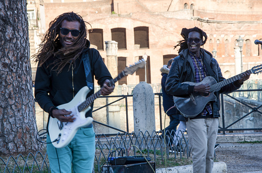 ROME, ITALY - JANUARY 1, 2017: African guitarists perform reggae music on January 1, 2017 in Rome, Italy