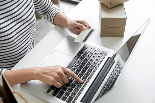 istock Woman's hands using credit card register and payments online shopping and customer service network connection market, using technology on laptop, Internet Online shopping or internet banking concept 891341384