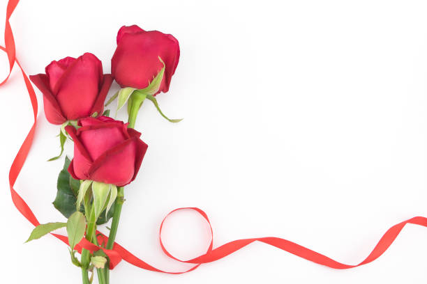 istock Red roses bouquet with red ribbon on white background 891344468