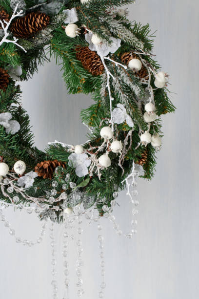 istock Christmas wreath of spruce with cones 891345062