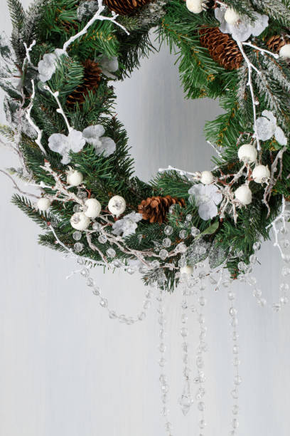 istock Christmas wreath of spruce with cones 891345074