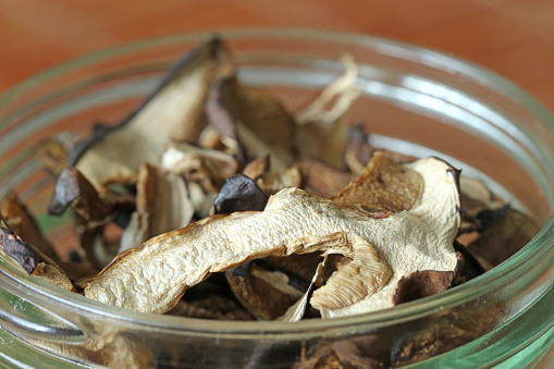 Close-up of a glass jar with dried mushrooms