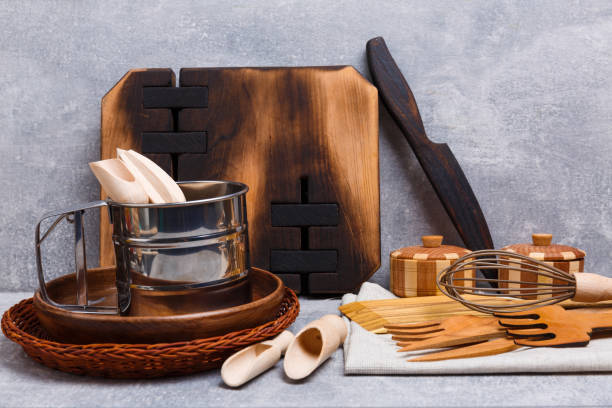 istock A top view on wooden cutlery on the light marble background. 891357280