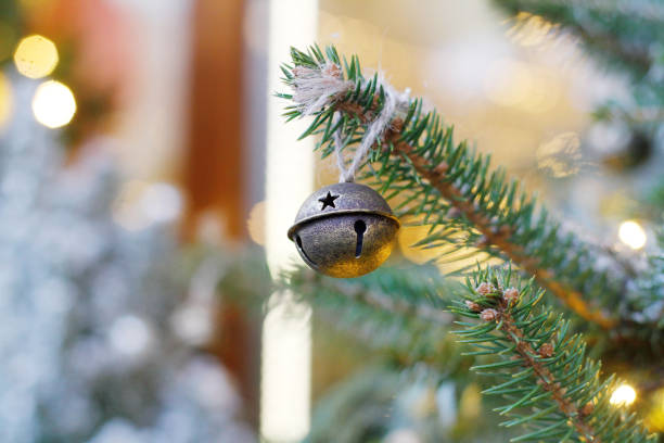 christmas toy bell on christmas tree outdoors - christmas decoration campanula decoration christmas imagens e fotografias de stock