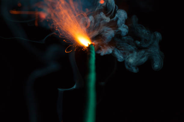 istock Burning fuse with sparks on black background 891364978
