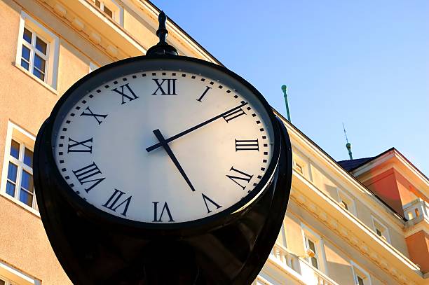 istock retro-style clock with a building in the background 89136789