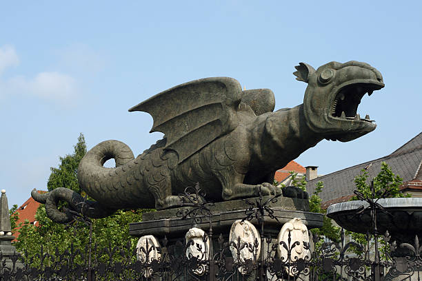 Krakow, Poland - July 31, 2024 :  View of  Wawel dragon spitting fire in the city