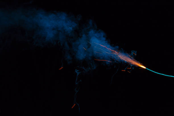 istock Burning fuse with sparks and blue smoke on black background 891381004